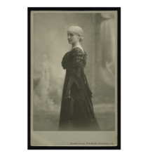 Studio portrait of Bertha Pappenheim wearing a dark, formal gown and long gloves