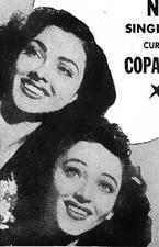 black and white photograph of two women with dark hair smiling
