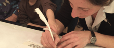 Julie Seltzer writing Torah with child