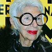 Iris Apfel smiling wearing black top and round black glasses at MIFF 2015