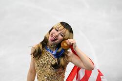 Alysa Liu smiles with her gold medal.