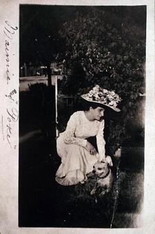 black and white photograph of a woman with a dog