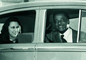 Pannonica de Koenigswarter and Teddy Wilson sitting in a car