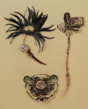 three pieces of jewelry using feathers, rope, and found objects, on cream-colored background