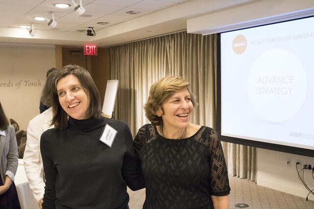 Rabbi Joanna Samuels (left) and Shifra Bronznick (right) both wearing black tops and smiling for photos
