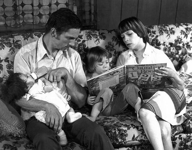 A Family Sitting on a Couch