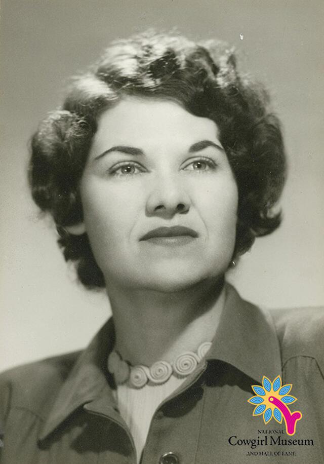 Portrait of Frances Kallison with short waved hair, collared top