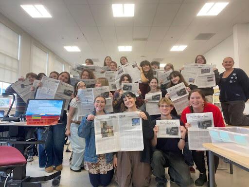 Franklin Post staff on distribution day of Issue 3. Naomi Granek Brown and Easton Atlansky, authors of the Jewish students article, are in the front displaying the spread.